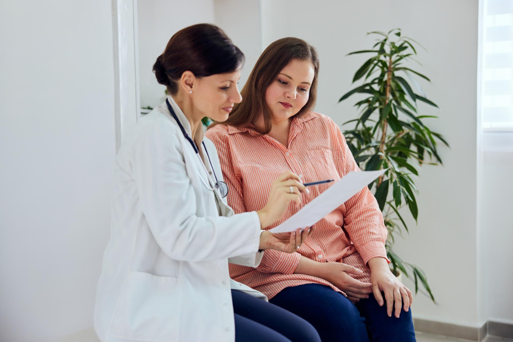 MOGA OB/GYN in Memphis going over a patient’s health history form with a young woman during a women’s health consultation